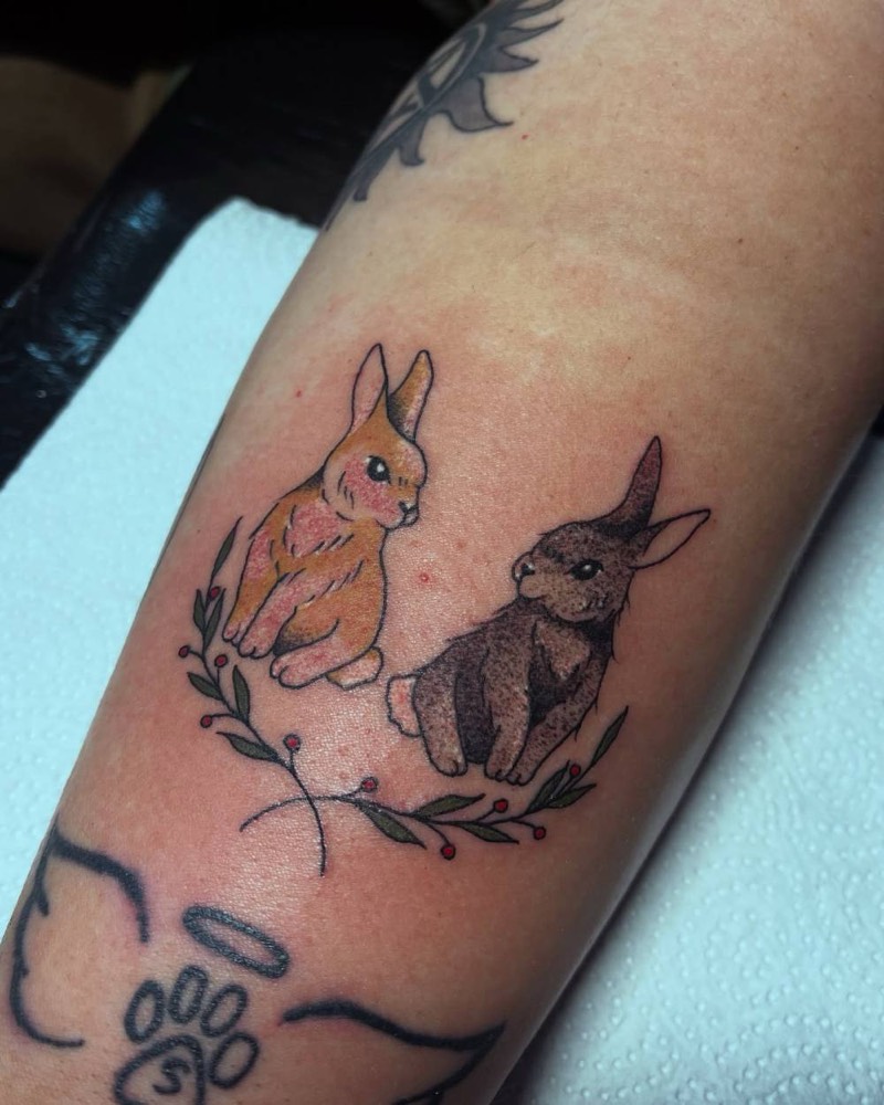 Two bunnies with a wreath