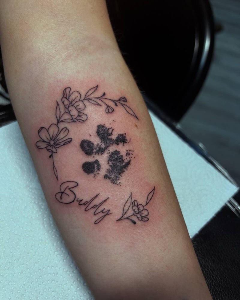 Paw print memorial with flowers